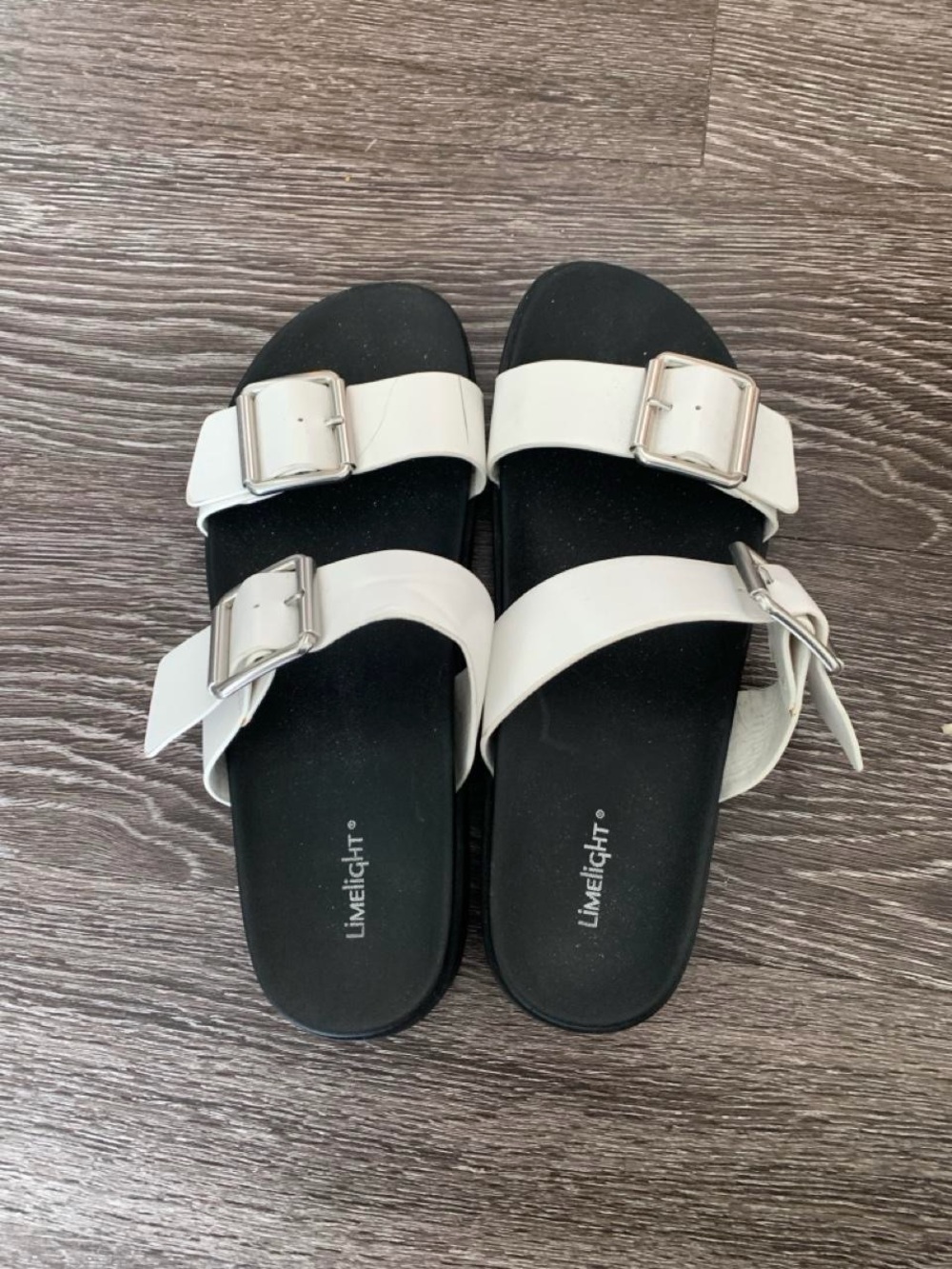 Limelight White Buckle Strap Sandals with Black Footbed